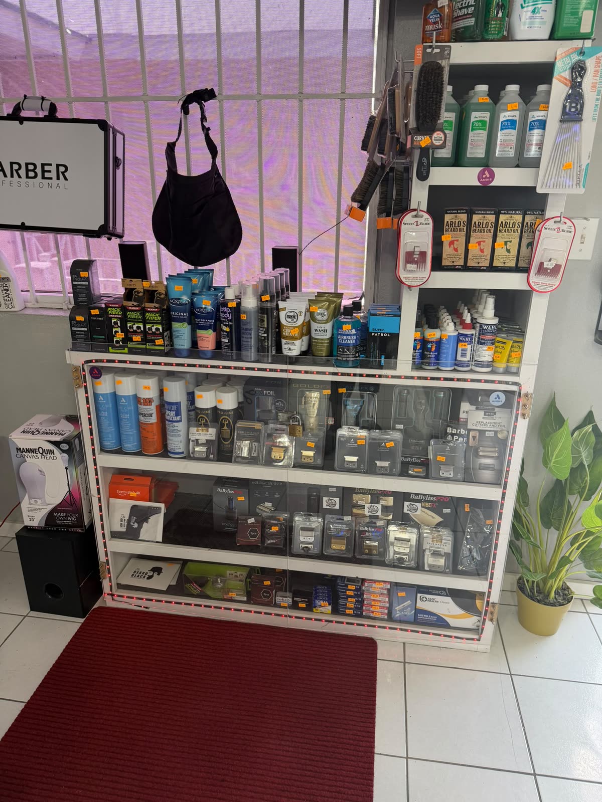 The retail display case stocked with clippers and grooming products